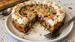 Soft-Baked Chocolate Chip Cookie Cake with Vanilla Cream and Sprinkles